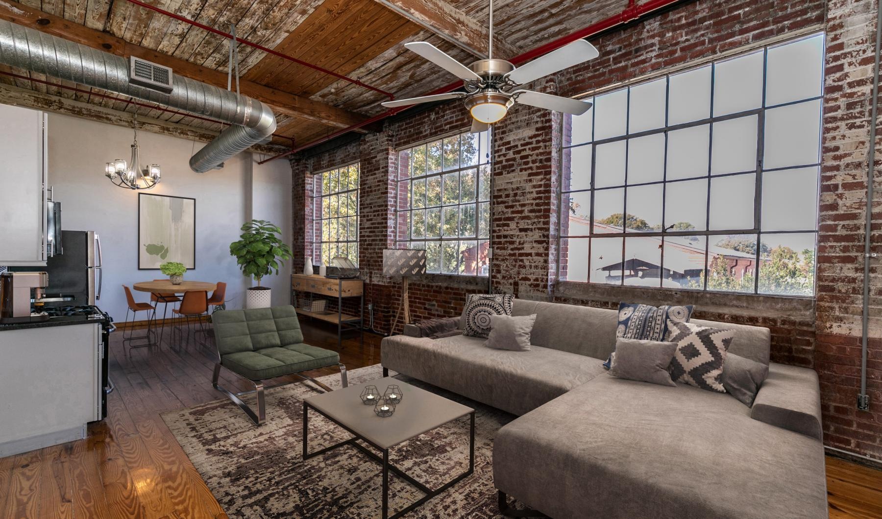 a living room with a brick wall