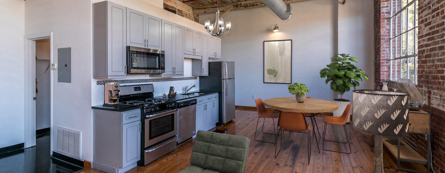 a kitchen with a table and chairs